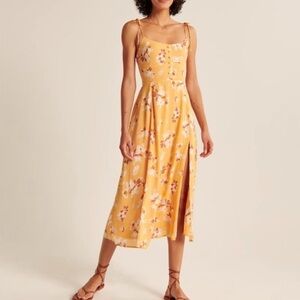 Abercrombie yellow floral midi dress with slit. Straps tie. New with tags